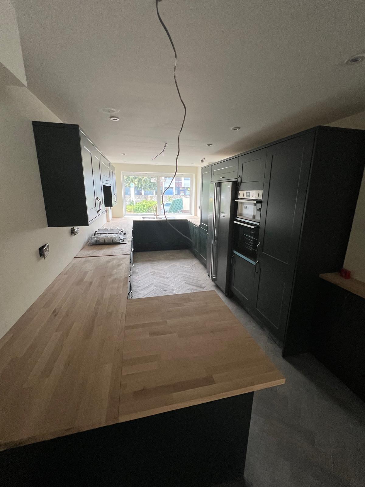 Integrated fridge, ovens and wine column.